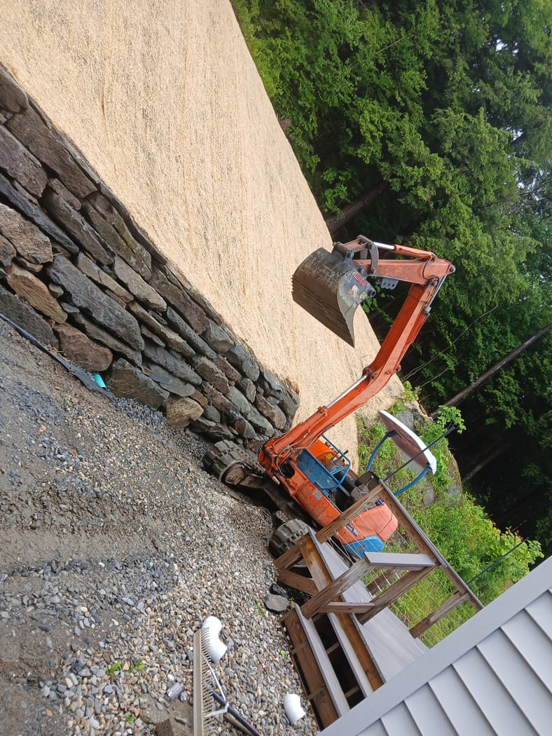Excavator on the wall line